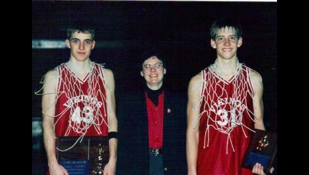 Former Midland coach Jana Jones, center, poses with Brad Hand, left, and Mark Reiman, right, after winning the Jones County Invitational in the 1990s. Jones, who died on New Year's Day, was the first woman in South Dakota to coach boys basketball. She was 63. Courtesy Photo