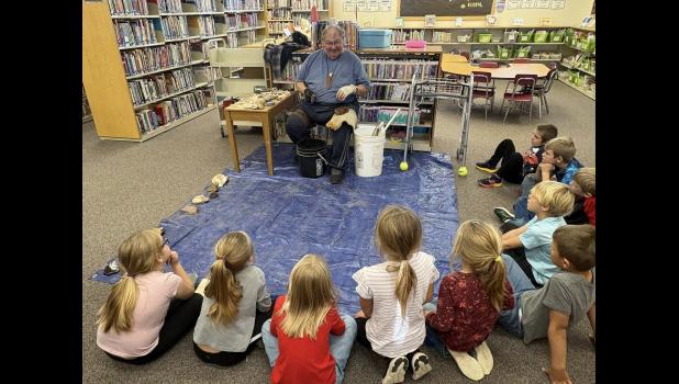 Mike Stocklin ... sharing his love of flintknapping and knowledge with students at Faith School. Photo courtesy Alison Grueb