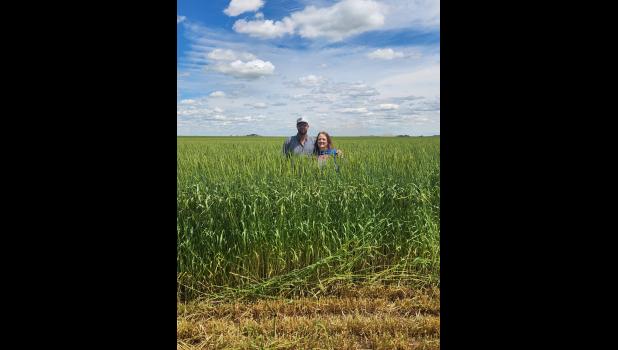 Brian LaDue with his mom Janet LaDue “outstanding in his field.”