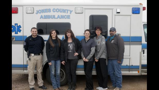 Five excited EMT students stop for a picture in front of the Jones County Ambulance after a successful morning of testing. Above (left) is instructor Heath Harter with students Rylee Metzger, Krisanna Thomas, Lacie Campbell, Vanessa Hight and Chris Letellier.