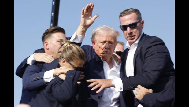 Republican presidential candidate and former President Donald Trump is rushed offstage during a rally on July 13, 2024, in Butler, Pennsylvania. Anna Moneymaker/Getty Images