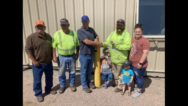 10 years with SDDOT ... Joel Larson - Supervisor of Bison, Lemmon and Faith, Jarvis Palmer - Faith Lead and John Mattheson - Area Engineer on behalf of SDDOT present Jesse King with his 10 year pin. Jesse’s wife Lorrie and children Woodrow and Wrenly were also there to celebrate. Photo courtesy Boyd Stambach