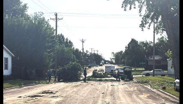Clean up ... began Sunday morning around town. People from inside City limits and out all came together and worked to get things cleaned up in the aftermath of the storm. Courtesy Photo