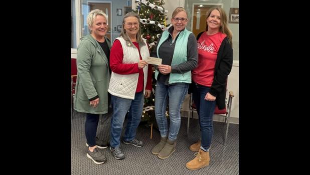 Pictured L to R are Ginger Dangerud, Hettinger, ND and Gladys Jackson, Spearfish, SD, members of the Jewel’s, presenting a start-up check for $200 to Bristol Palmer, Adm. Asst. and Darla Kahler, 7-12 English teacher at BHS, who are also members of the All School Reunion Committee. This check will be put into the fund for saving and preserving the BHS graduate class pictures.