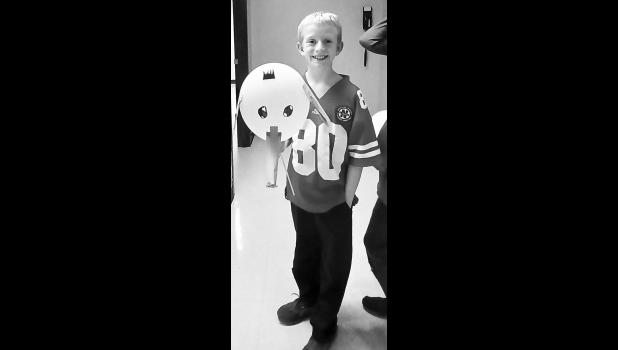Mason Martinez smiles with his Horton hears a Who balloon creation. Photo by Jo Buchannan