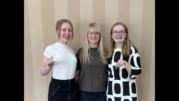 Lila Besler, Mrs Bridget Vanderpool, and Channing Reiff with their medals they received at Regionals, they now advance to State Competition.