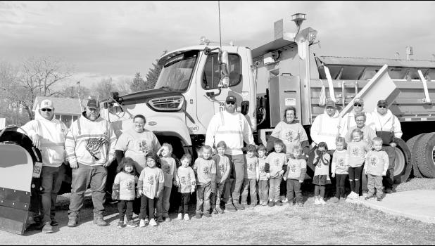 The Jones County Preschool class poses in front of Scoopy Scoopy Doo, the snow plow they named for the Winner area, along with their teachers and DOT employees. Photo by Mishayla Buchannan