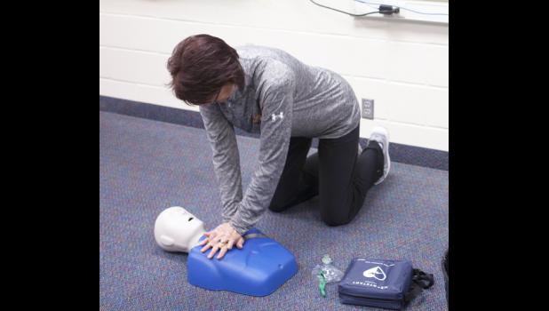 Vanessa Hight shown completing the AED - CPR skill station on test day. CPR was one of many skills taught through the EMT class.