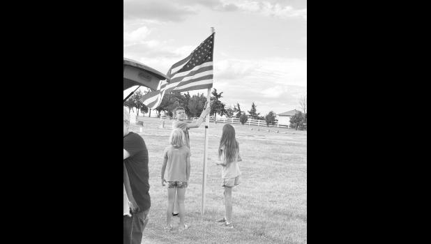 These kids were a huge help for taking down the flags. Photo by Mishayla Buchannan