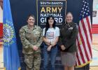 Ruby Lensegrav (center) enlisted in the Army National Guard. Ruby will attend basic training after graduation.